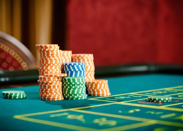 Live game show host presenting wheel-based game with betting interface